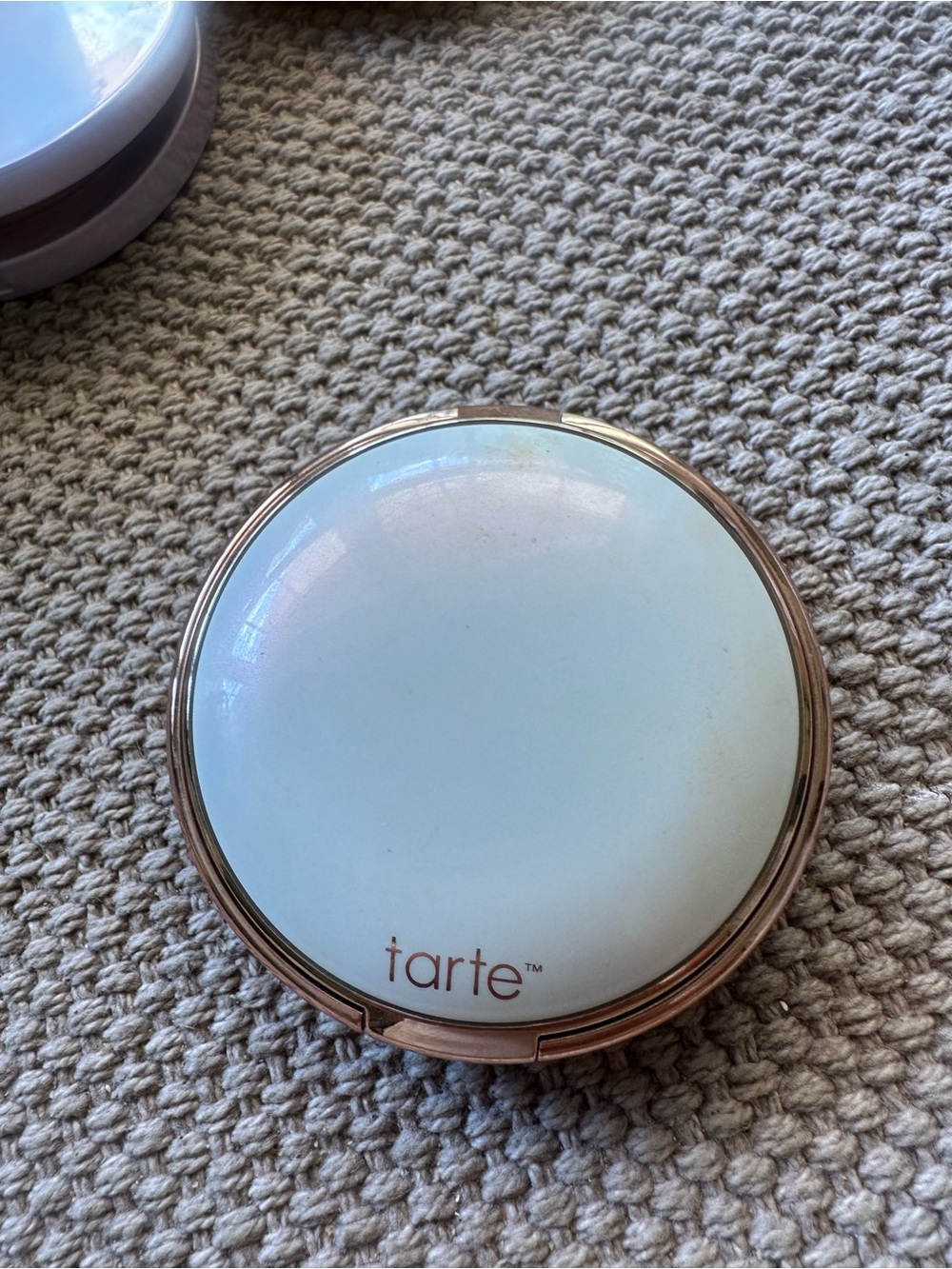 Tarte compact on carpet